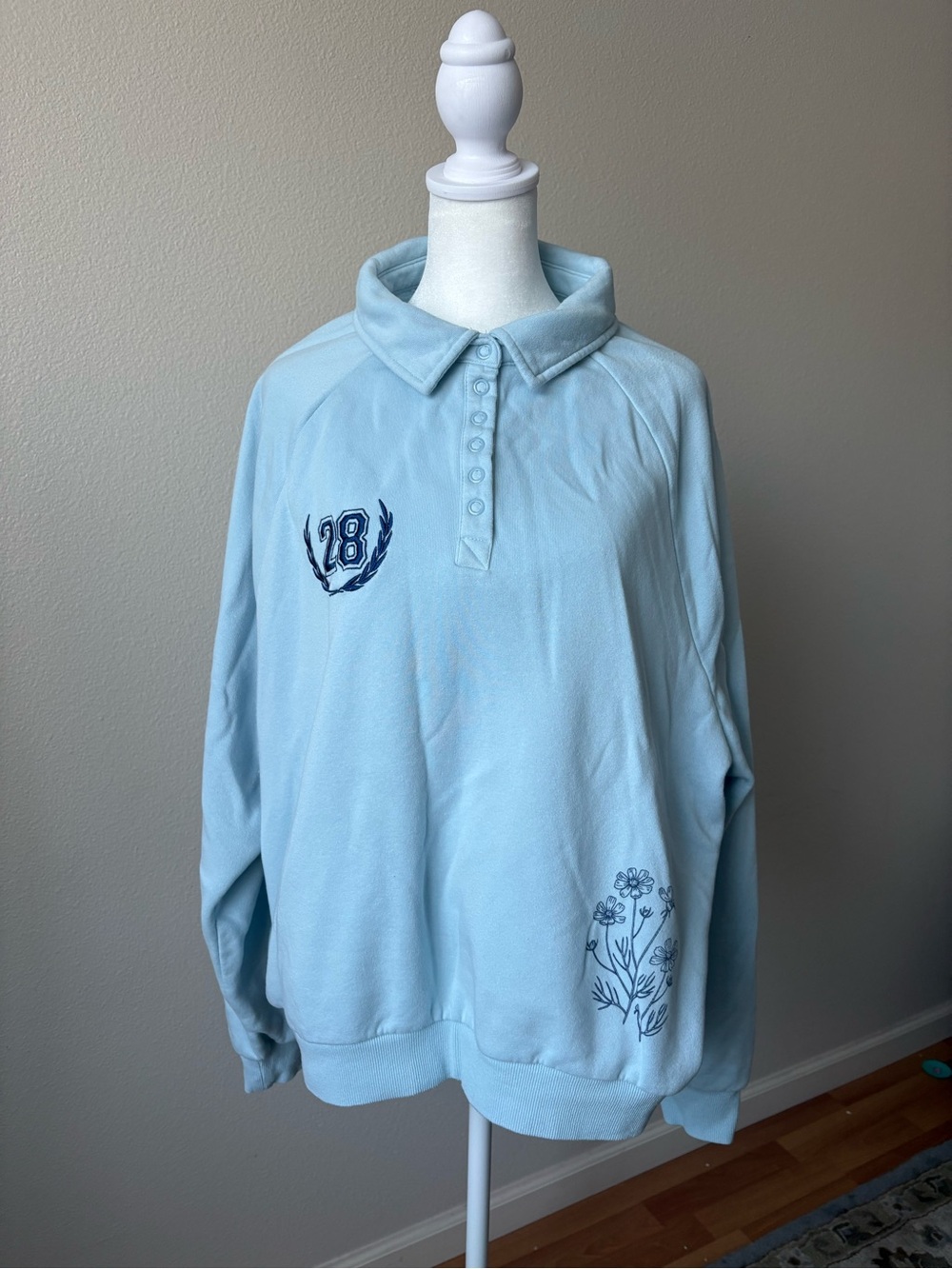 Light Blue Women's Polo Sweatshirt with Floral Accent
